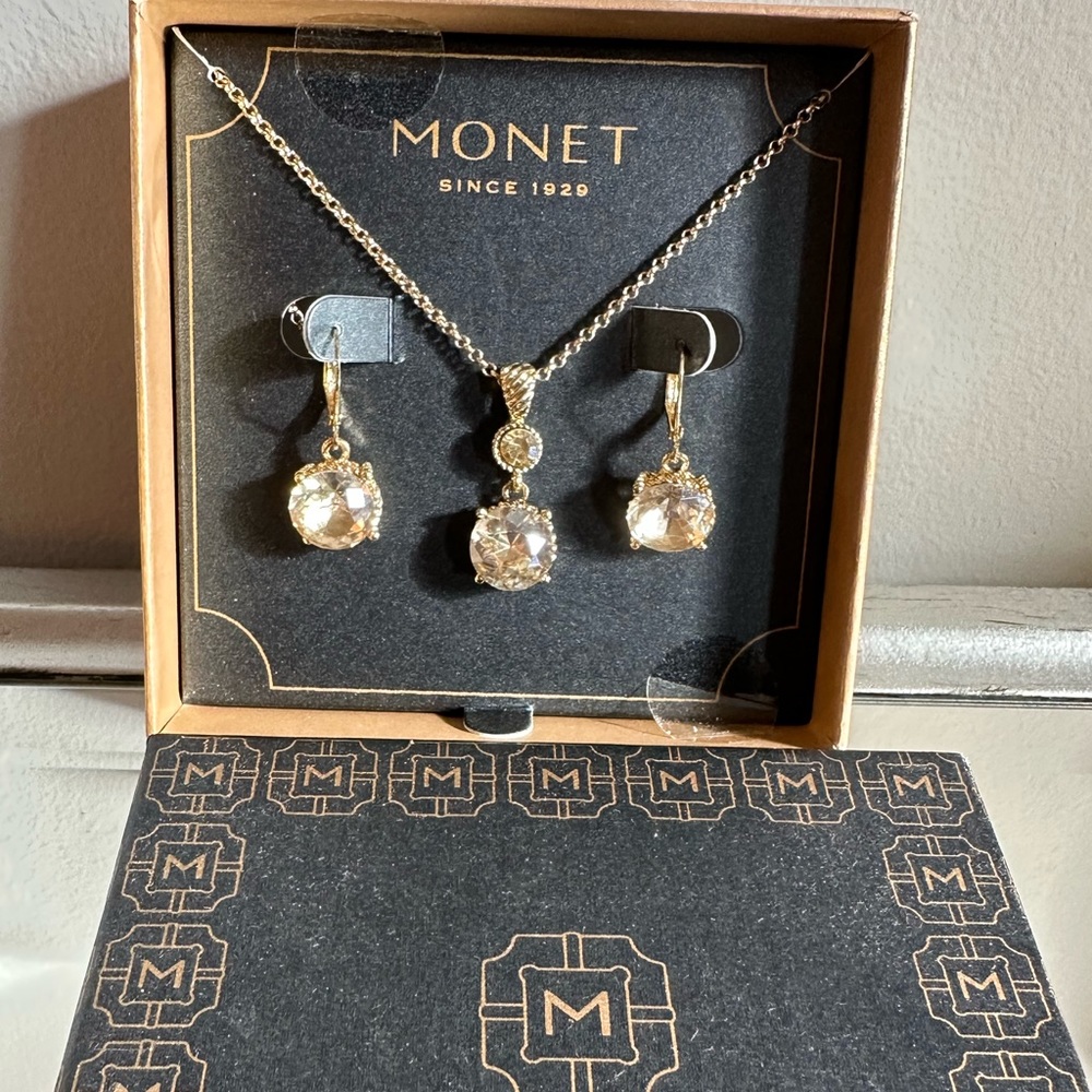 Monet beige rhinestones in gold tone necklace with matching earrings.